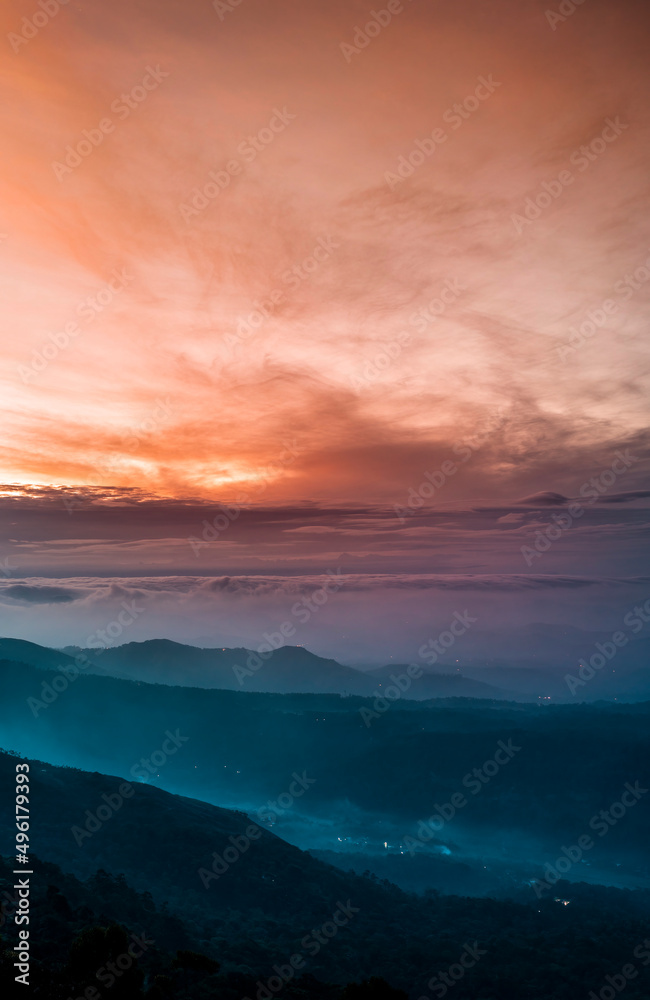 Mountains under mist in the morning Amazing nature scenery  form Munnar Kerala God's own Country Tourism and travel concept image, Fresh and relax type nature image