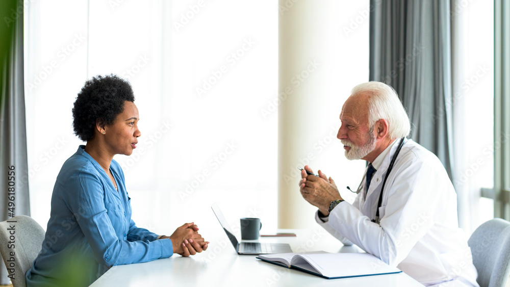 African woman consulting doctor about her medical condition African woman consulting doctor about her medical condition