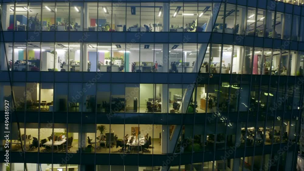 Aerial view of the windows of the skyscraper and office space at night. Aerial view of the windows of the skyscraper and office space at night.