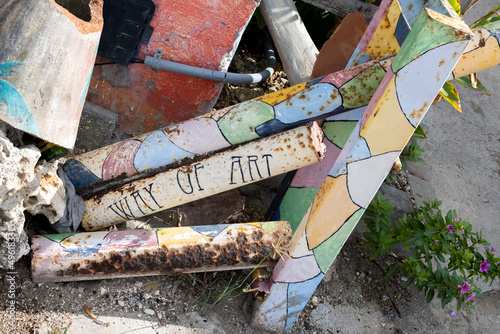 Rusty pipes with the text "WAY OF ART" in Willemstad, Curacao