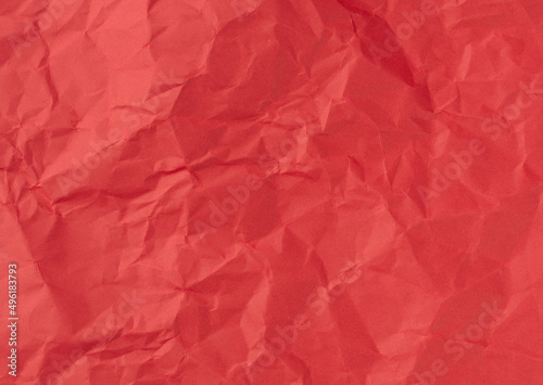 Wrinkled sheet of red, paper. Textured backdrop
