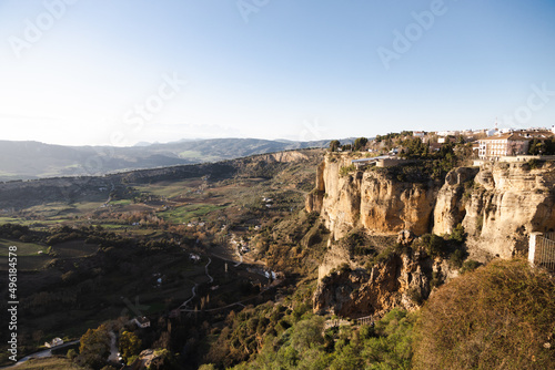 town of ronda at sunset over canyon