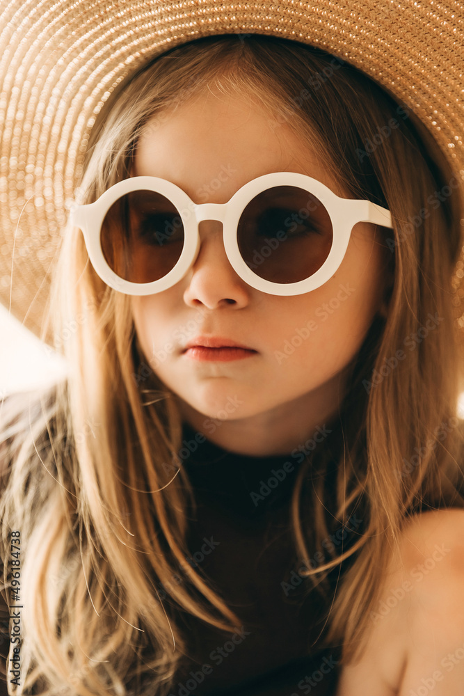 stylish studio portrait of a little girl in white-rimmed glasses stylish studio portrait of a little girl in white-rimmed glasses