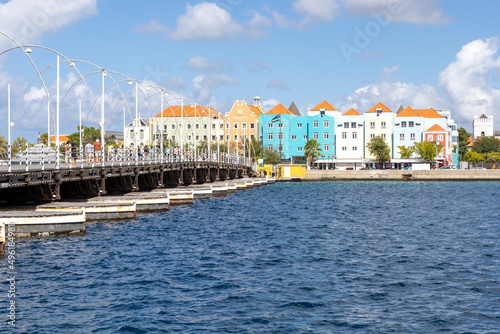 The famous Queen-Emma-Bridge with colorful buildings of the district Otrobanda in Willemstad, Curacao