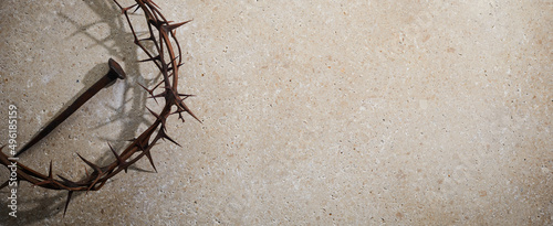 Foto Easter concept. Crown of thorns with Nail on a stone background.