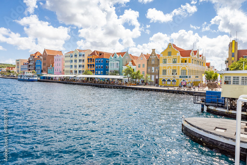 Famous colorful waterfront buildings in dutch-caribbean, colonial style viewed from the Queen-Emma-Bridge in Willemstad, Curacao