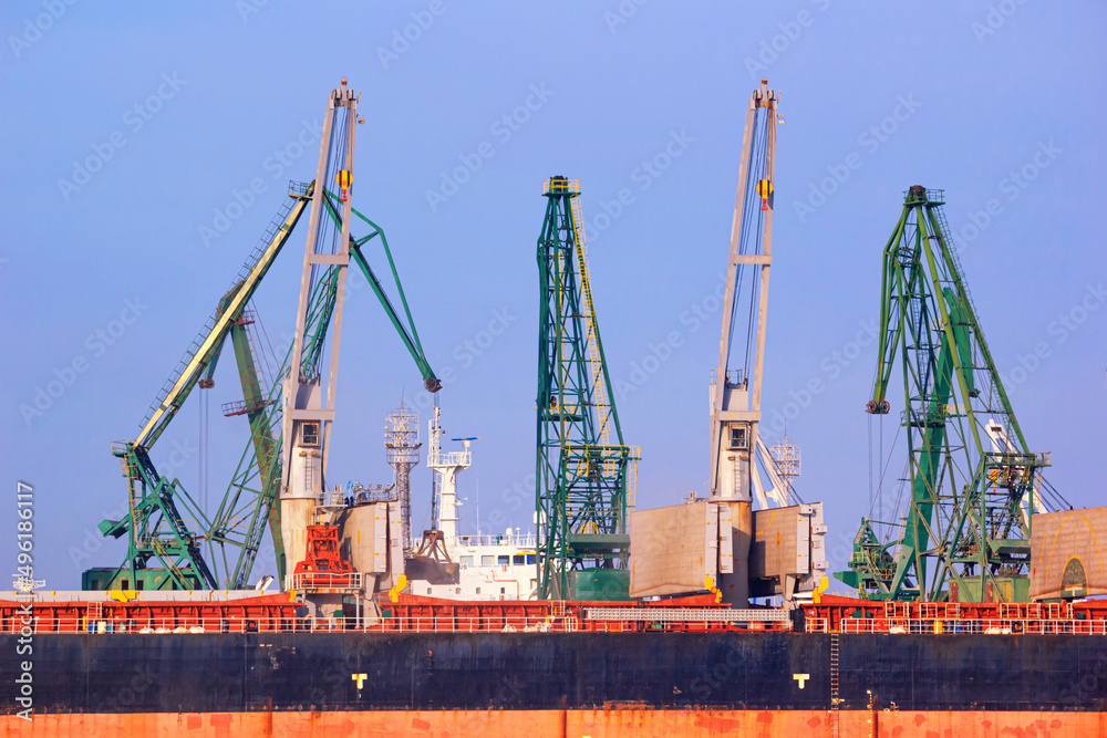 View of the harbor cranes and cargo ships in the seaport of Varna, on the Black Sea coast of Bulgaria