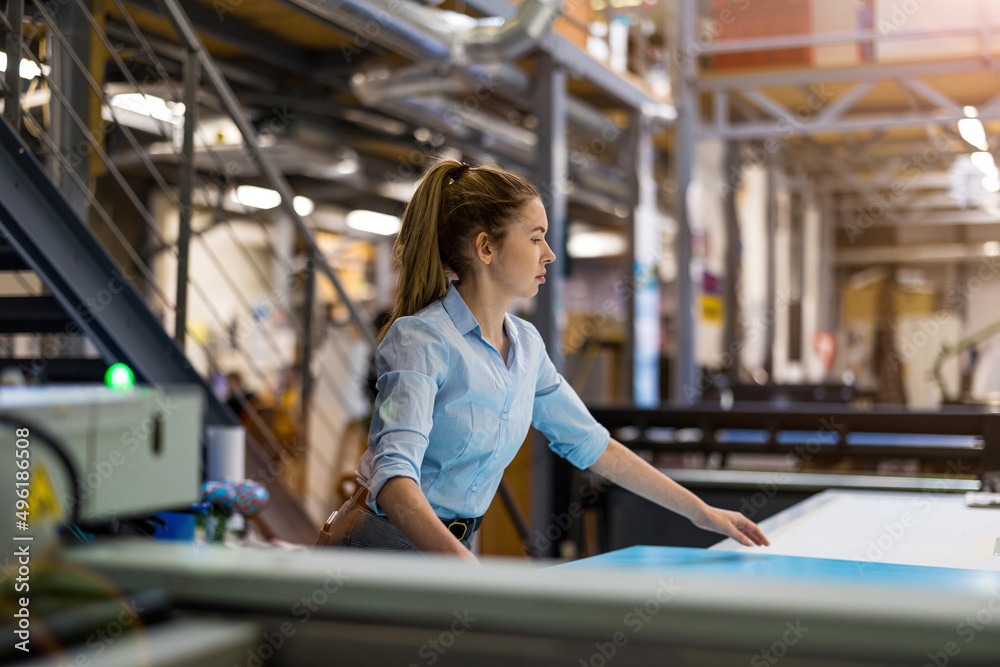 Fototapeta premium Woman working in printing factory 