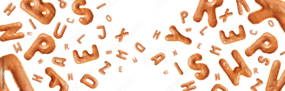 Chaotic flying letters made of real cookies, isolated on white background, closeup