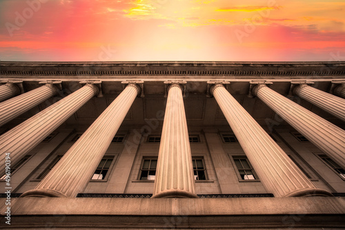 Fototapeta Classical columns on government building with colorful sky