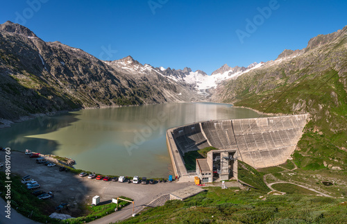 Oberaarsee, Switzerland - August 13, 2021: The Oberaarsee is the highest reservoir in the headwaters of the Aare in the canton of Bern in Switzerland photo