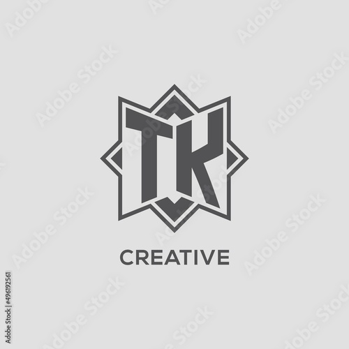 Monogram TK logo with eight point star style design