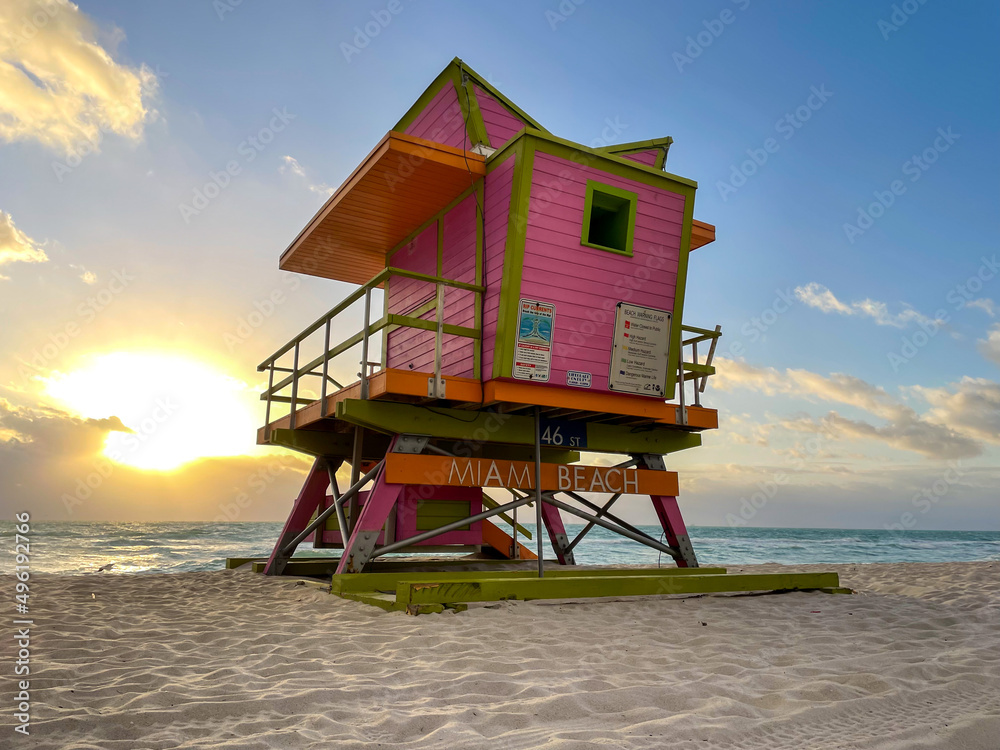 Iconic orange and pink lifeguard house in Miami Beach. Beautiful sky at sunrise