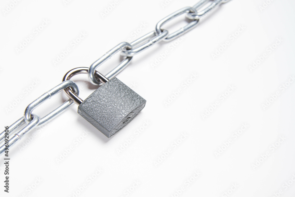 Chain and padlock on an isolated background. closed door. Metal chain. Chain and padlock on an isolated background. closed door. Metal chain.