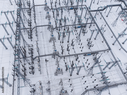 Aerial view of a high voltage electrical substation in winter season.