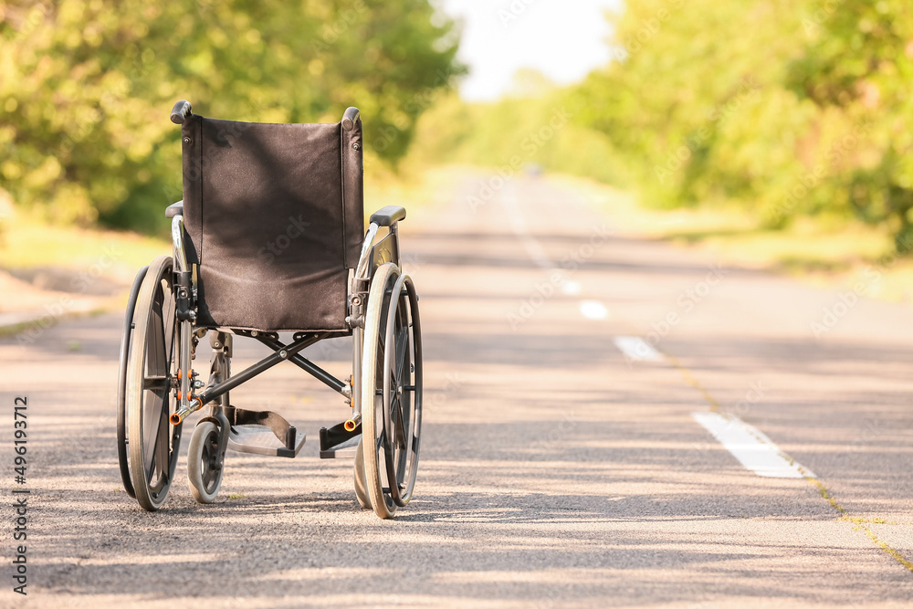 Empty modern wheelchair on road outdoors