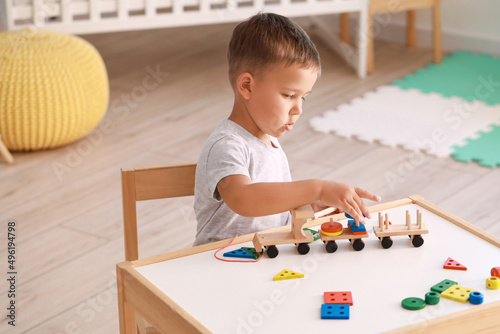 Cute little boy playing wit...