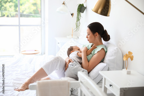 Beautiful young mother brea...