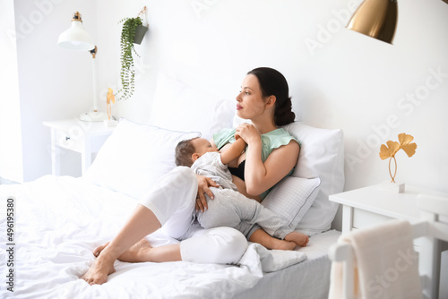 Beautiful young mother brea...