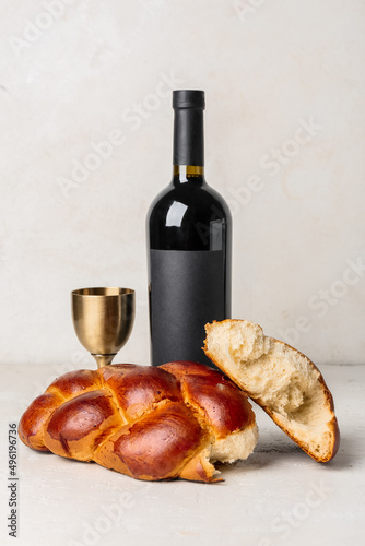 Obraz na plátně Traditional challah bread with wine on white background
