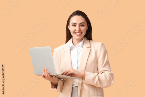 Pretty young businesswoman ...
