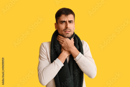 Ill young man with sore thr...