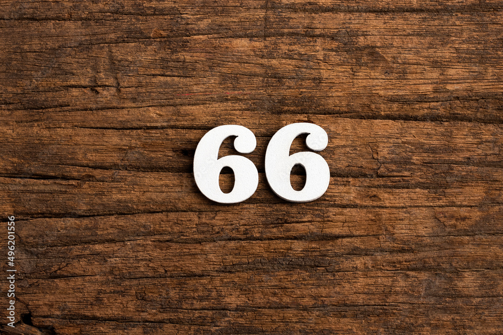 Number 66 - piece on rustic wood background Number 66 - piece on rustic wood background