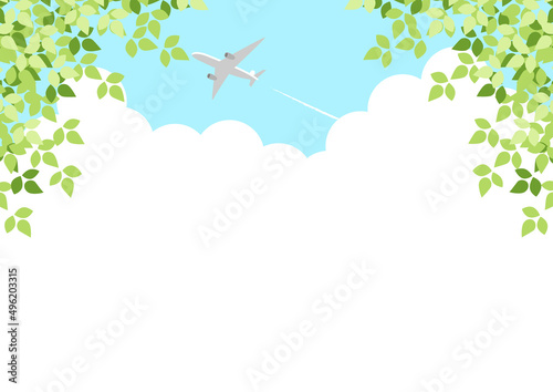 入道雲と飛行機の新緑背景