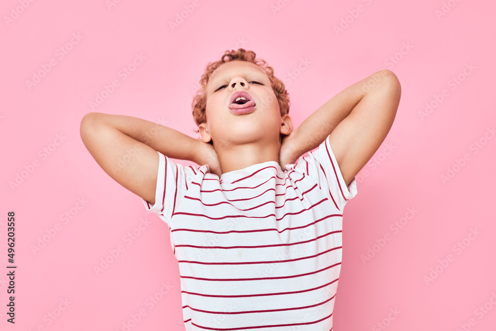 portrait of a boy in casual t-shirt pink color background portrait of a boy in casual t-shirt pink color background