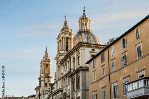 The dome and towers of the Sant'Agnese in Agone, or St. Agnes Cathedral as the sun sets over the Piazza Navona in the historic center of Rome, Italy 