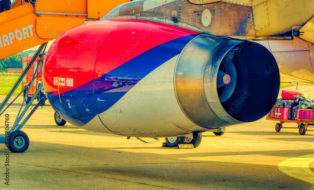 Airbus air plane engine colored in red, blue and white color.