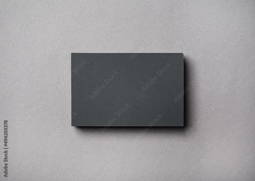 Blank gray business card on concrete background. Top view. Flat lay. Blank gray business card on concrete background. Top view. Flat lay.