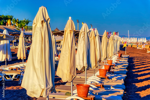 A beach cleared and ready for new day at the late afternoon of summer day in Antalya, Turkey.