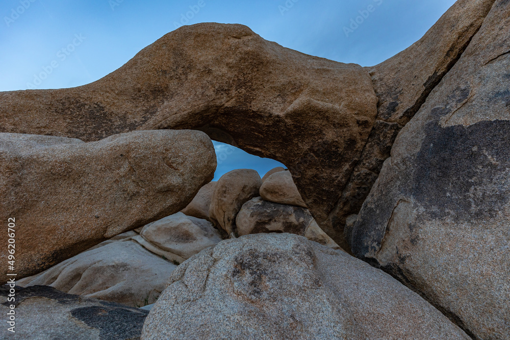 large rock formation in front of blue sky large rock formation in front of blue sky