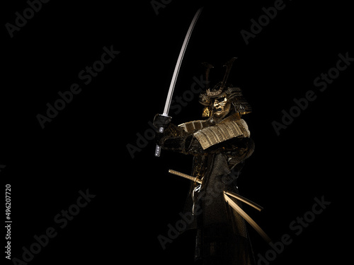 Vászonkép A samurai wearing golden armor and holding a sword