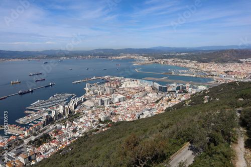 Panoramic view over Gibraltar harbour from the top of the Rock of Gibraltar. The airport runway juts out into the water.