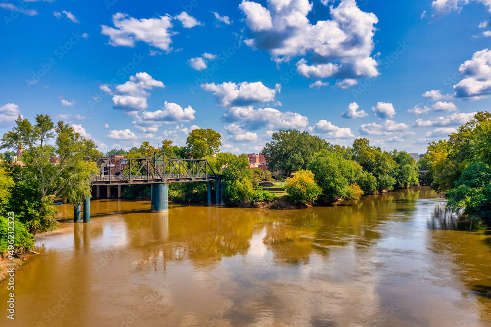 Brown water, trees and clouds River bridge Brown water, trees and clouds River bridge