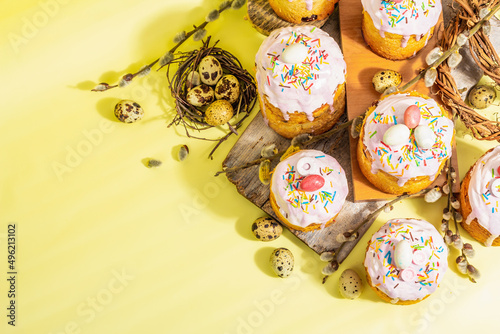 Traditional Easter cake. Festive sweet food with icing and decor. Eggs, nest, willow