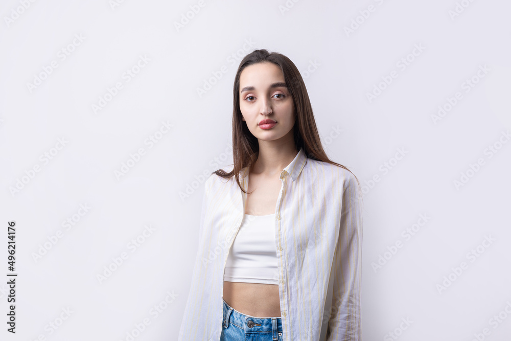 Portrait of a beautiful young woman thinking, isolated on white background Portrait of a beautiful young woman thinking, isolated on white background