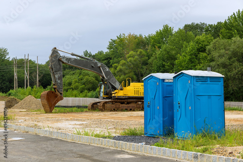 Portable toilet at construction site for worker in a building photo