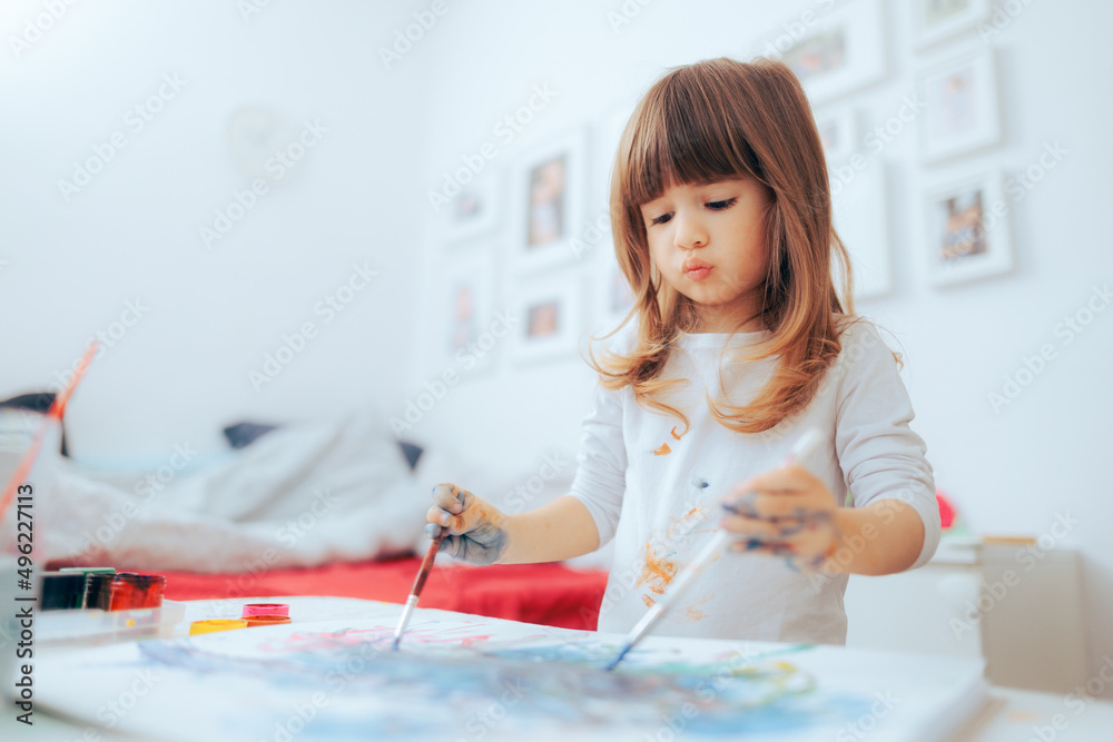 Ambidextrous Little Child Painting with Both Hands 