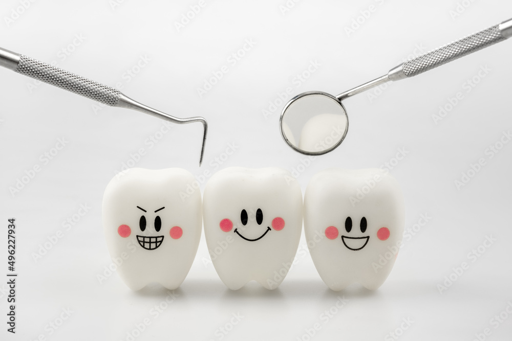 Teeth smile emotion with dental mirror and dental plaque cleaning tool on white background