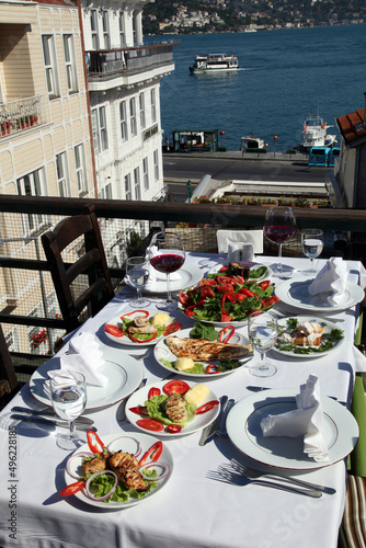 Turkish sea foods and Turkish appetizer foods on the restaurant table at Bosphorus in Istanbul, Turkey. photo