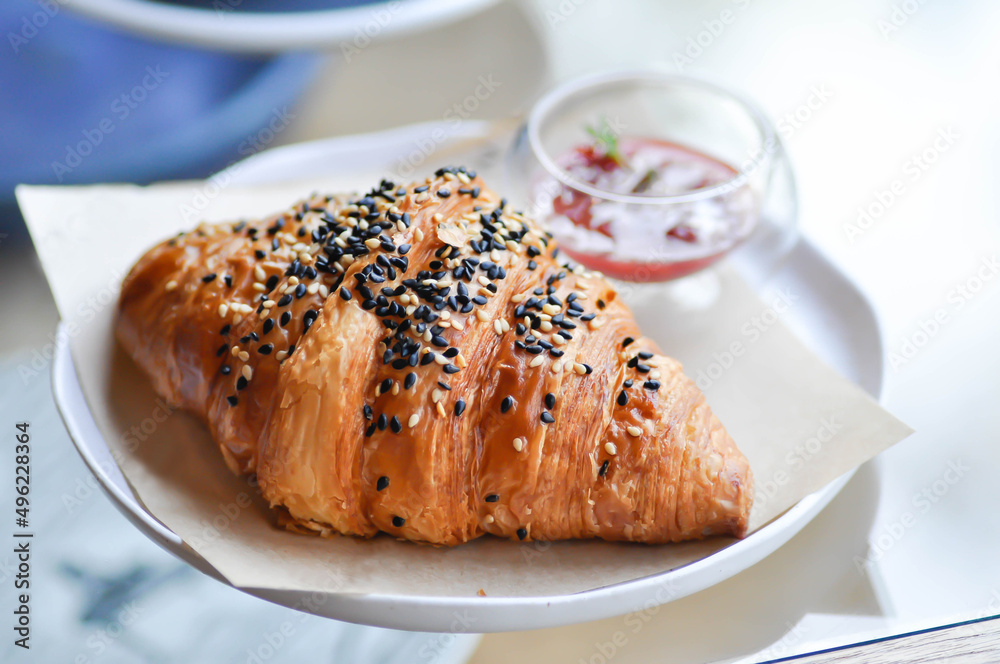 croissant , French croissant or French bread with sesame topping and  dressing