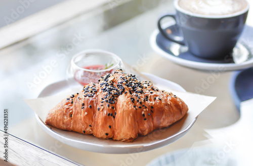 croissant , French croissant or French bread with sesame topping and coffee