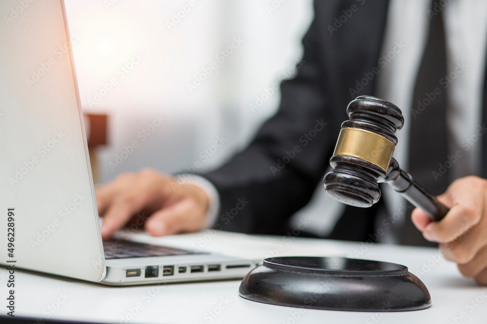 judge on wooden table And experienced lawyers meet with clients and give advice behind the scenes. legal services legal consulting concept judge on wooden table And experienced lawyers meet with clients and give advice behind the scenes. legal services legal consulting concept