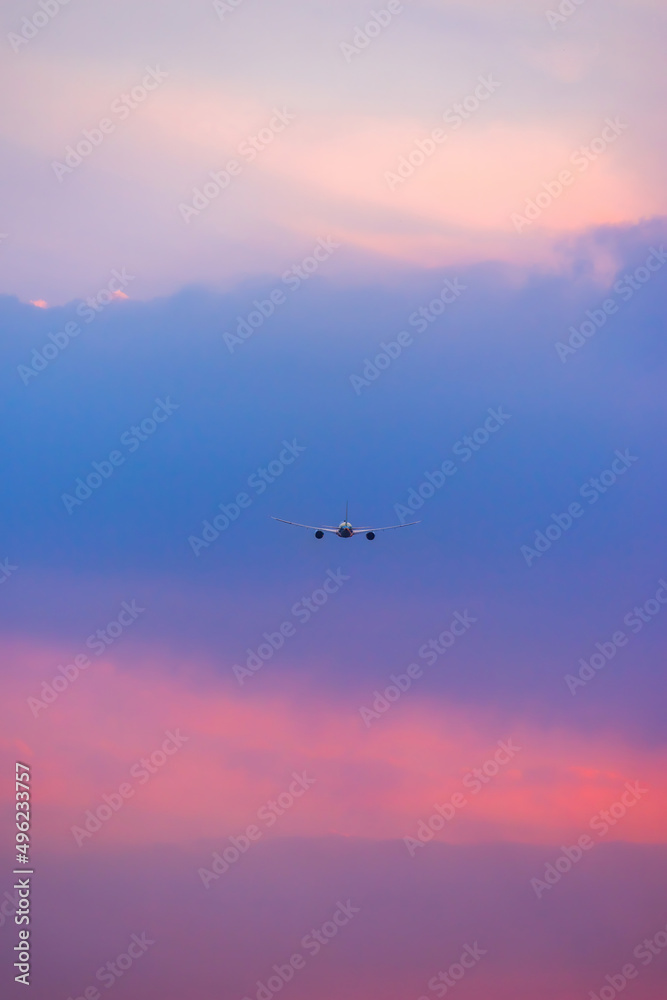 Air transportation system used to transport people and goods by air. Fresh blue sky, colorful sky wide airplane, pink and pastel color of sky, sunlight and sunset view.