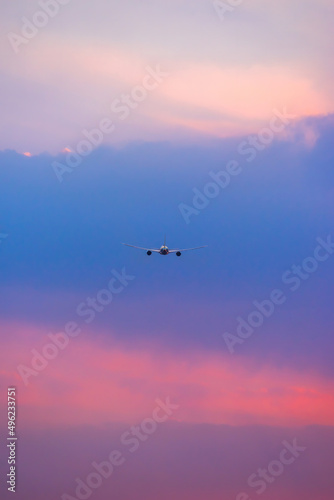 Air transportation system used to transport people and goods by air. Fresh blue sky, colorful sky wide airplane, pink and pastel color of sky, sunlight and sunset view.