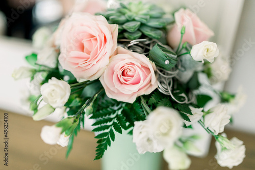  Wedding flowers, bridal bouquet closeup. Decoration made of roses, peonies and decorative plants, close-up, selective focus.