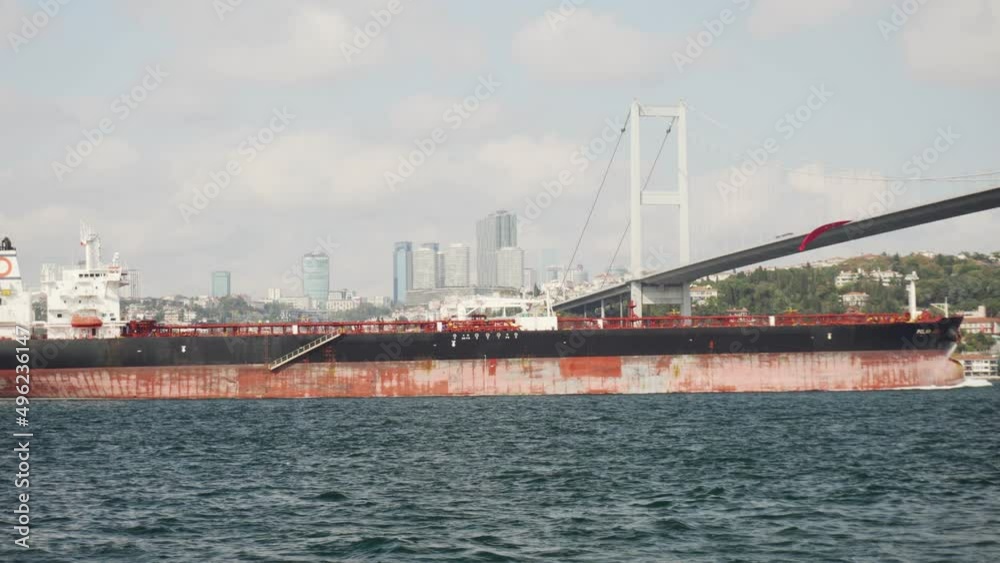 Tanker passes through the Bosporus. View of the Bosphorus Bridge Tanker passes through the Bosporus. View of the Bosphorus Bridge